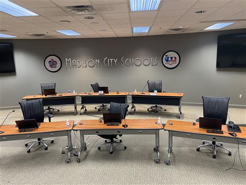 Photo of Board room with seats spread out 